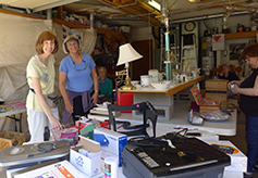 Volunteers happily adjust  the merchandise